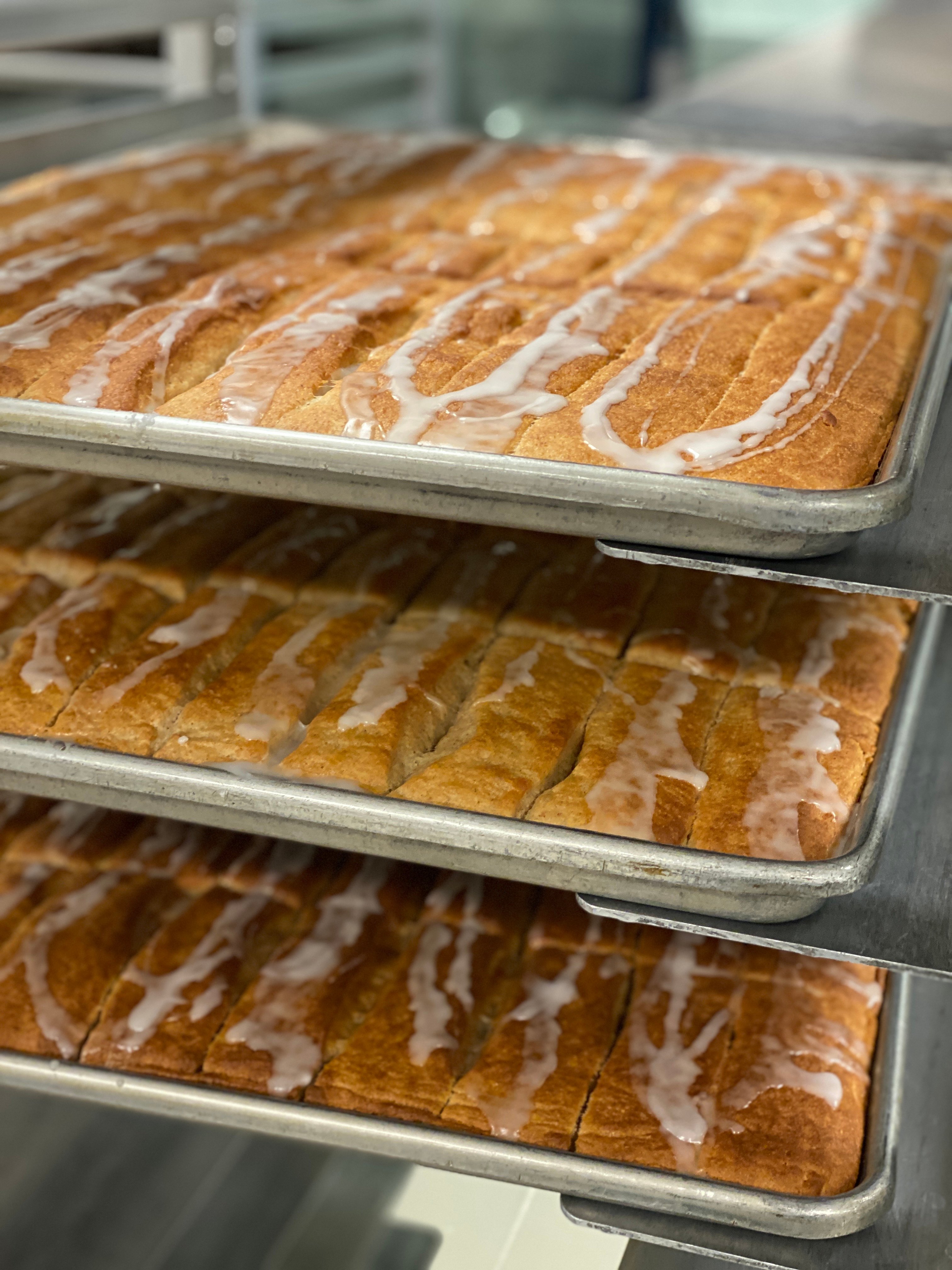Cinnamon bread on racks in the kitchen.