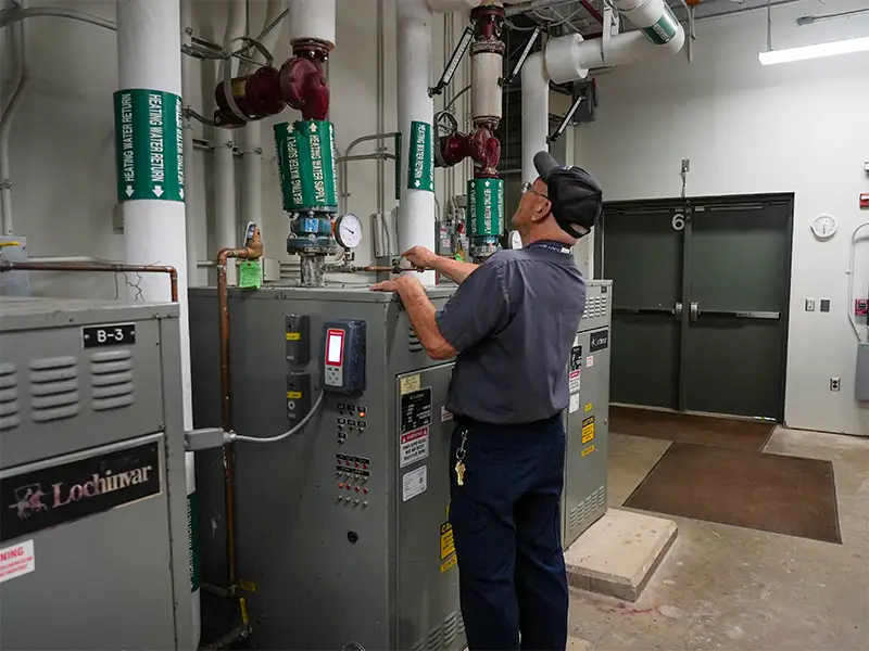 PWCS facilities staff working in machine room