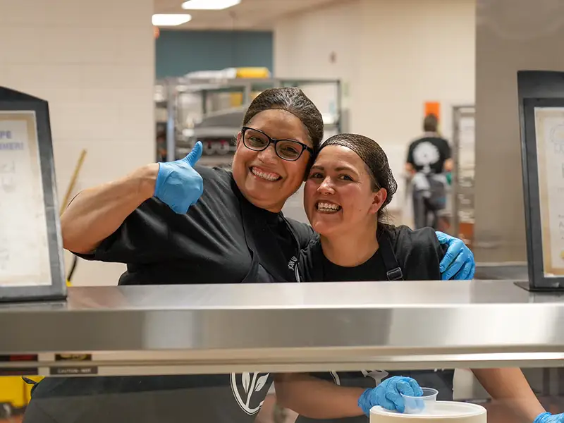 PWCS smiling in a school cafeteria