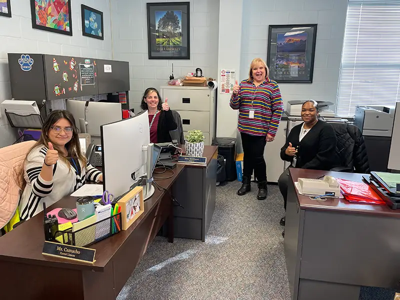 school staff smiling