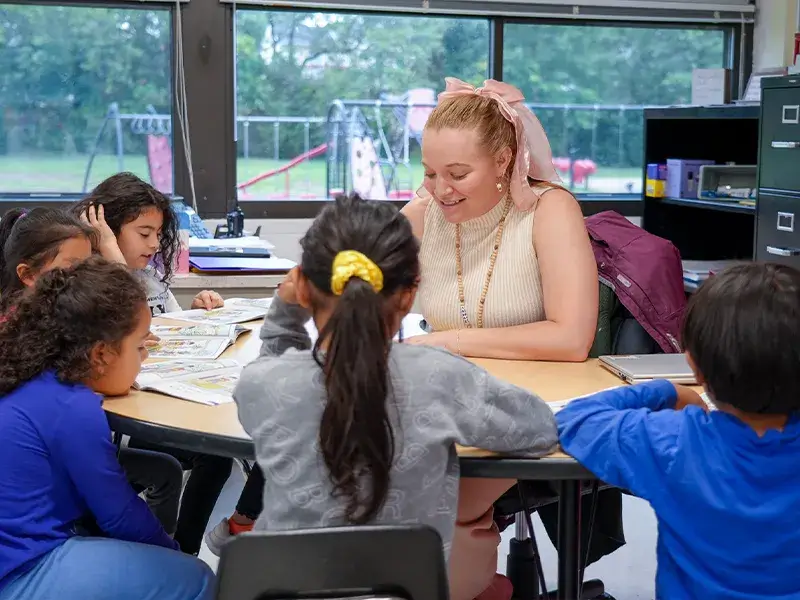 Elementary school teacher leading a reading lesson