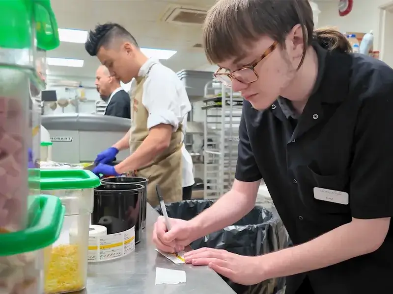 Student in a kitchen participating in Project SEARCH