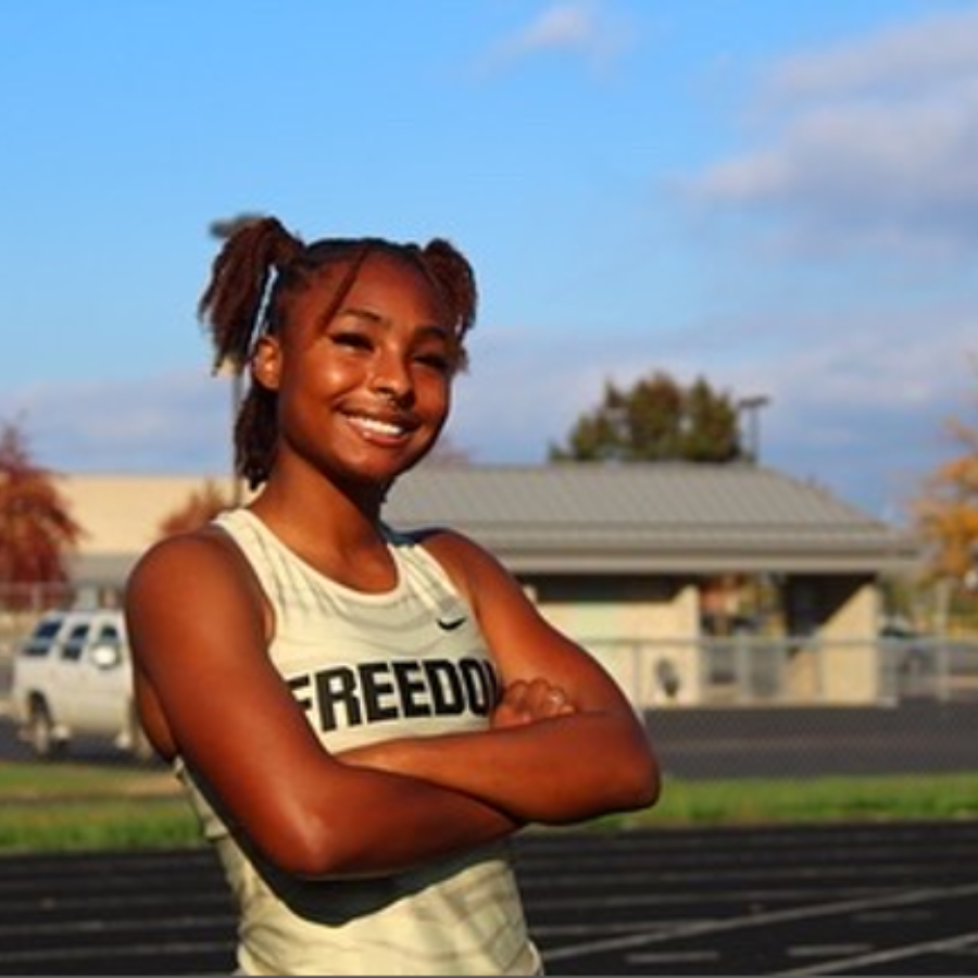 Freedom High School female track student with arms crossed and smiling