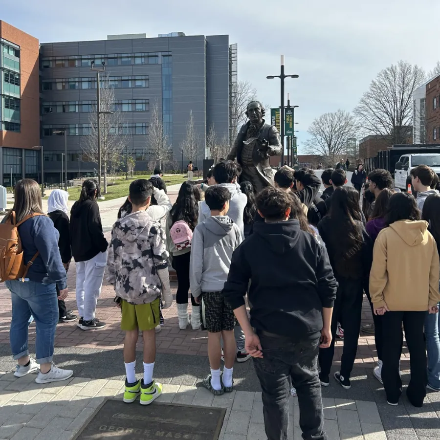 photo of PWCS students observing statue at George Mason University campus