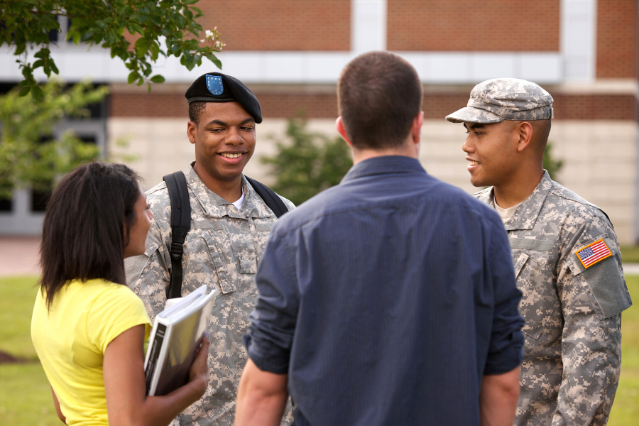 Two ROTC students talking to a male and female student