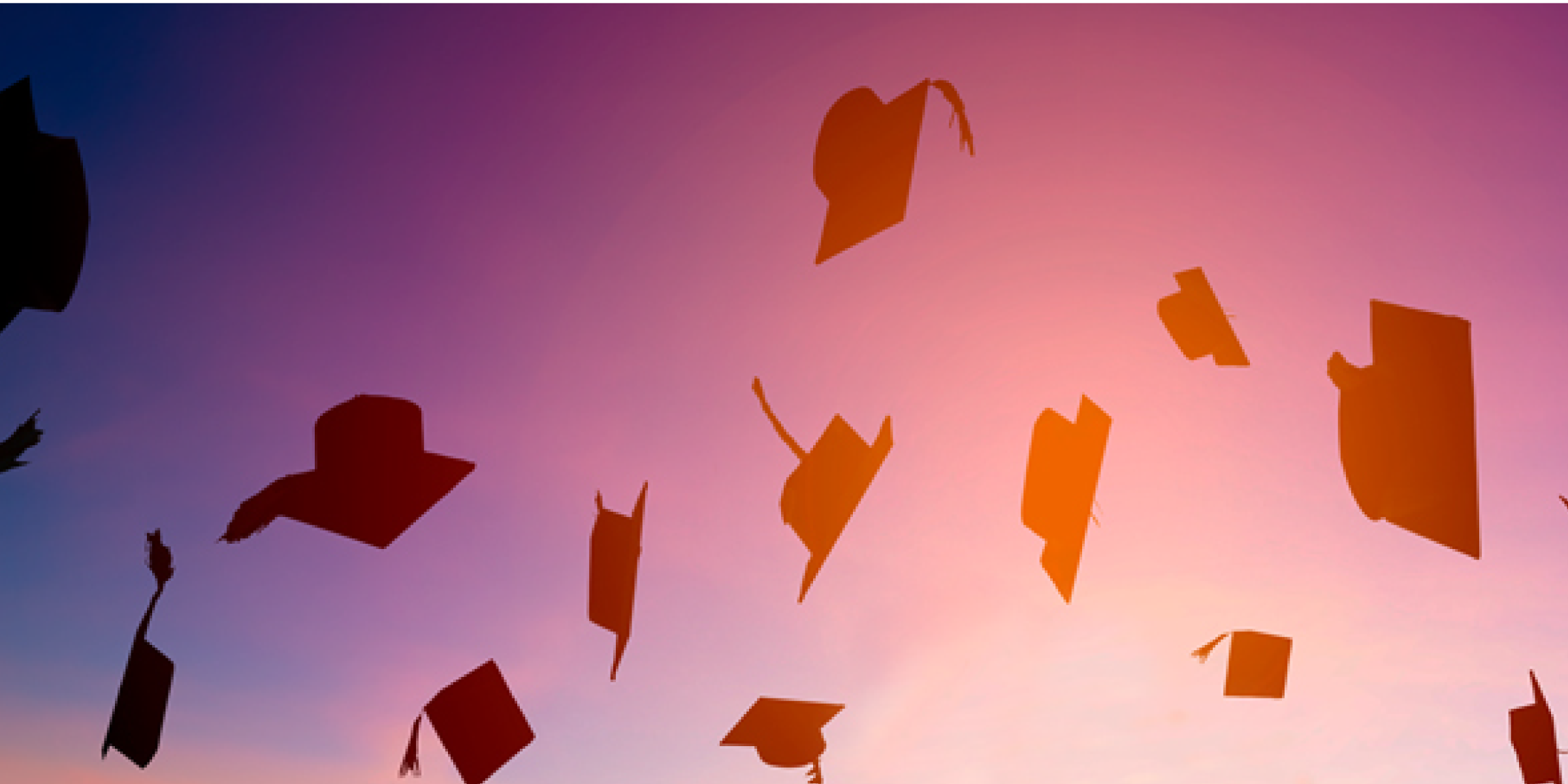 Graduation caps in the air