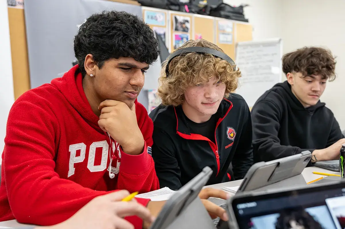 High schools student working on an iPad while seated in the classroom