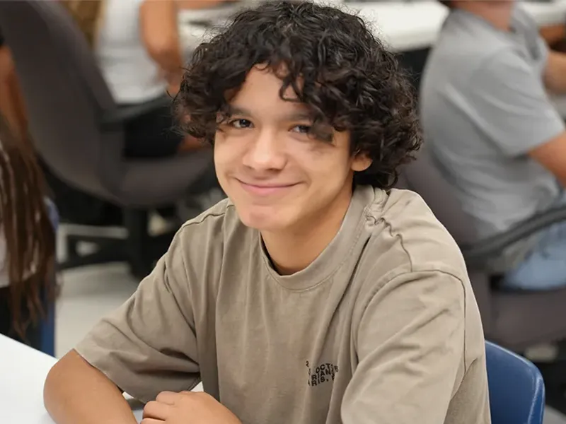 High school student seated at a desk