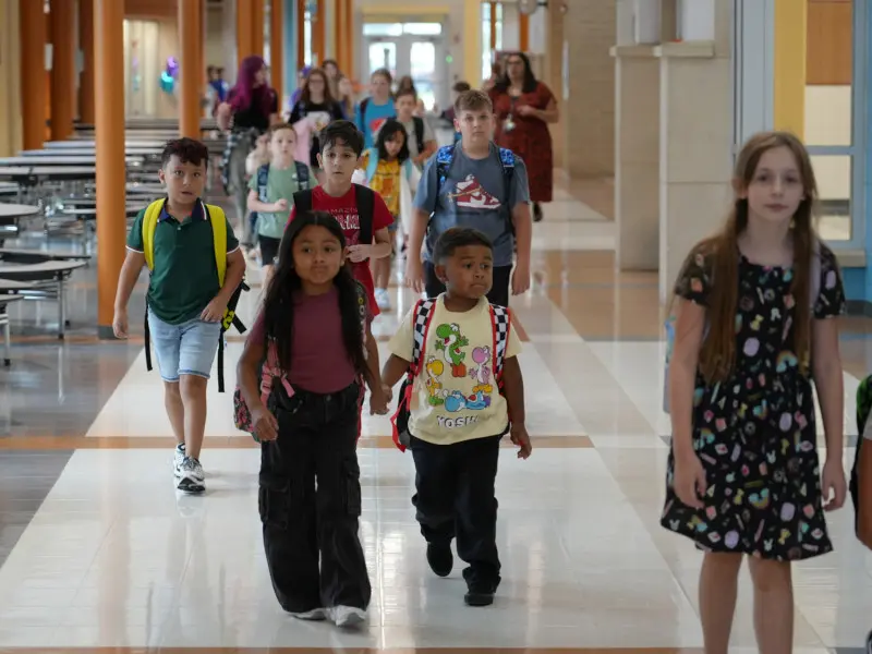 Students arriving to school on the first day of school