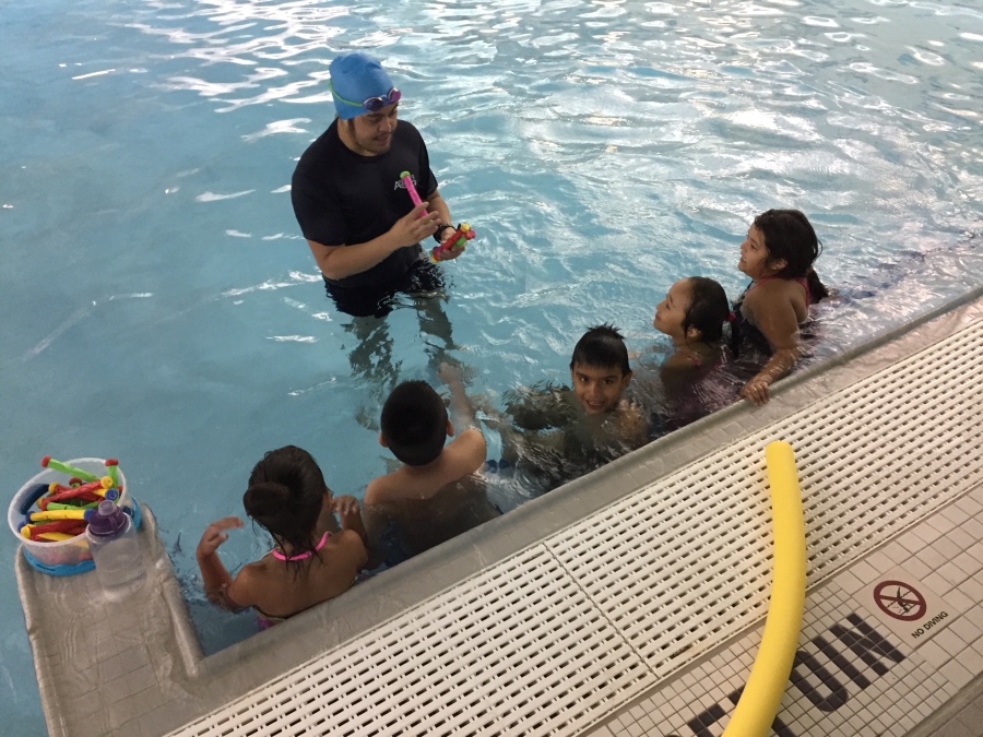 Students in the pool during Water Safety School