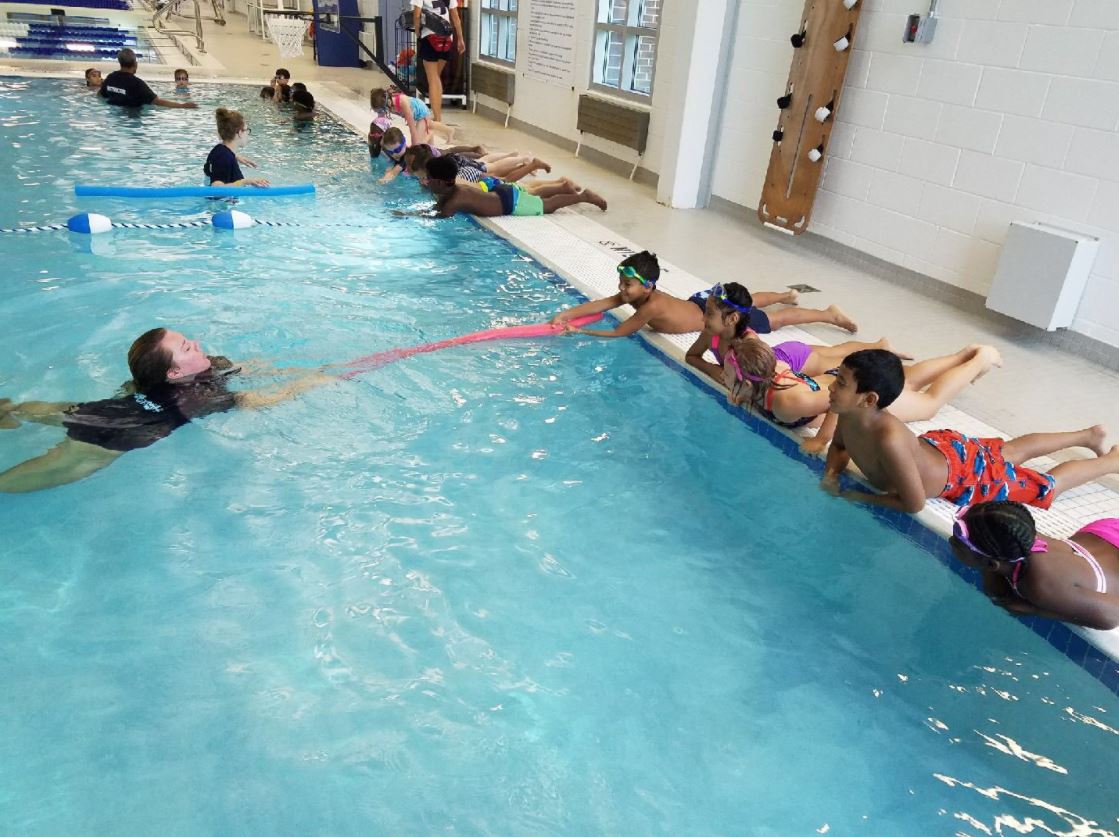 Students in the pool during Water Safety School