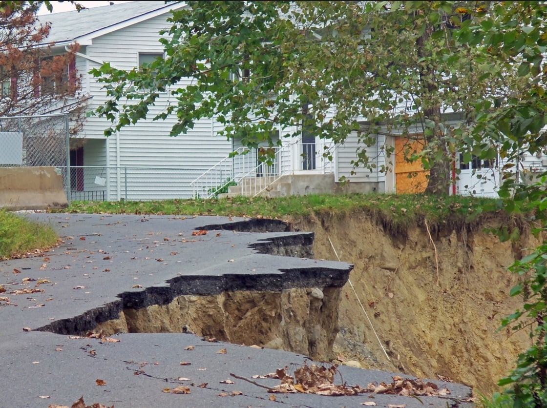 a street that has been damaged by street water