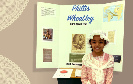 A young female student dressed up at Phyllis Wheatley