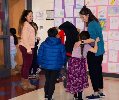 Author, Angela Dominquez merits a big hug following her presentation at Yorkshire Elementary.