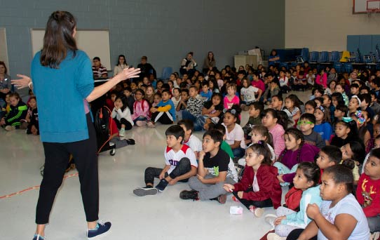 Author and illustrator, Angela Dominquez speaks to Yorkshire Elementary students