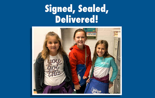 Three students work at Wee Deliver at Tyler Elementary