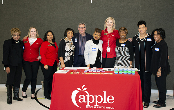 Coalition and PWCS members gather at the Apple FCU goodie table