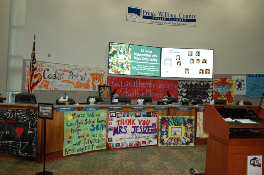 The School Board dais with a variety of the art work that was hung as a part of School Board Appreciation Week