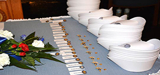 Nursing caps and pins laid out on a table