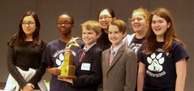Lake Ridge Middle School students with trophy after winning Battle of the Books