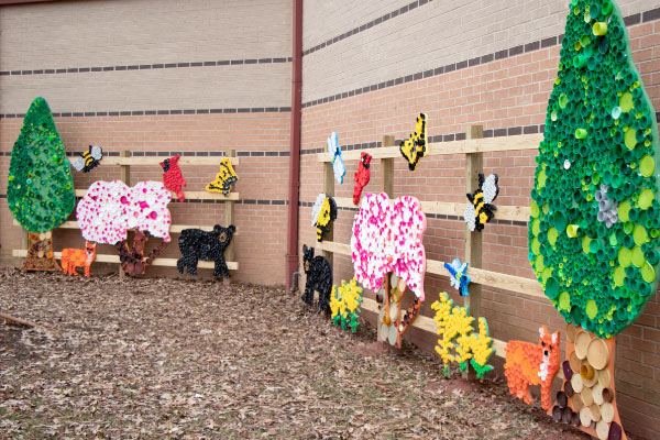 Trees and animals art installation decorated with bottle caps