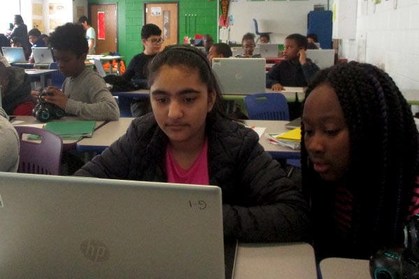 two female students working at a computer