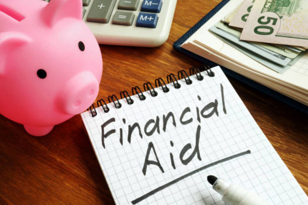 Image of a notepad with the words financial aid