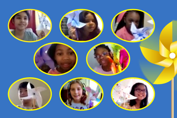 Eight young students in separate circles holding pinwheels.