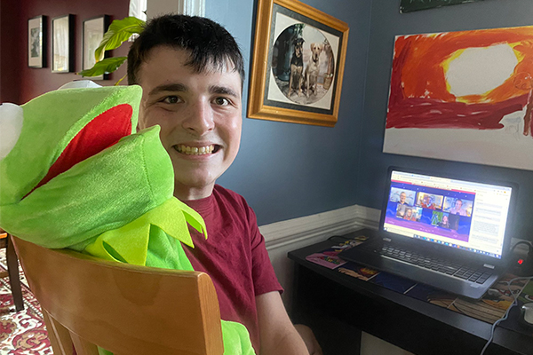 Photo featuring the Colgan High School junior Nathan Blevins and his puppet