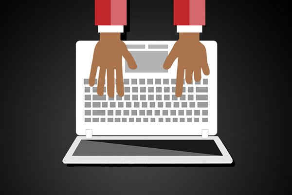 image of hands on a laptop keyboard