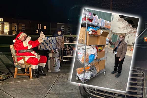 Santa sitting in a chair on the sidewalk in front of Rosa Parks Elementary School. Picture of a female volunteer in front of a wrack of donated food items.