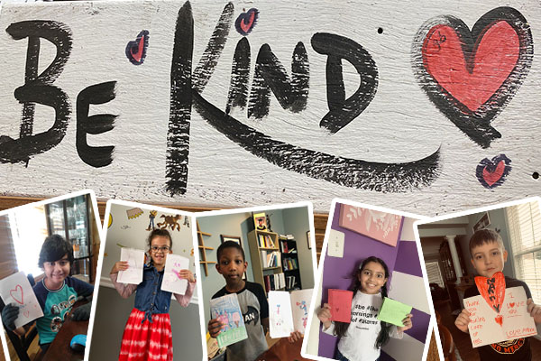 Rosa Parks ES students and staff with Be Kind signs and valentines