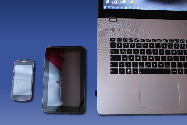 photo image of a cell phone, tablet, and laptop and the words: PWCS online auction offers deals