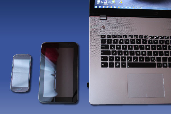 photo image of a cell phone, tablet, and laptop and the words: PWCS online auction offers deals