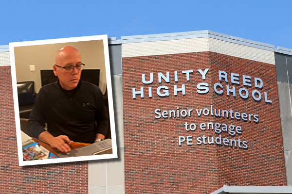 Unity Reed High School exterior with a photo of an adult man