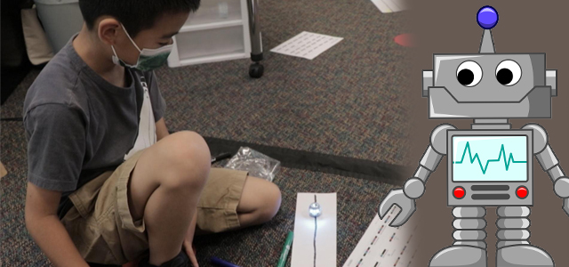 Student with Ozobot robot