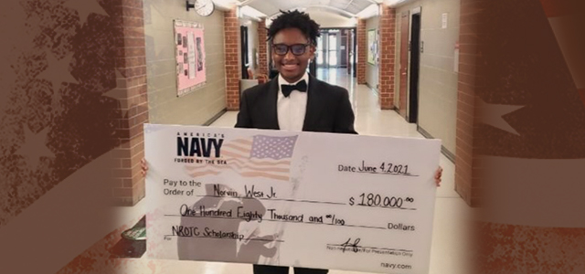 Colgan High School student Norvin West Jr. holding a novelty check for $180,000, representing the JROTC scholarship that he received