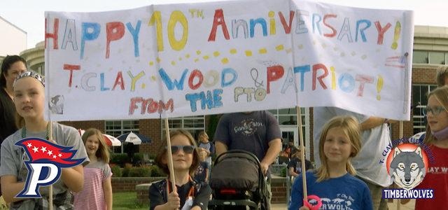 Students holding sign in parade