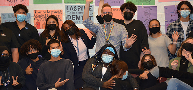 Unity Reed High School physics teacher and students in silly group photo with Superintendent Dr. McDade