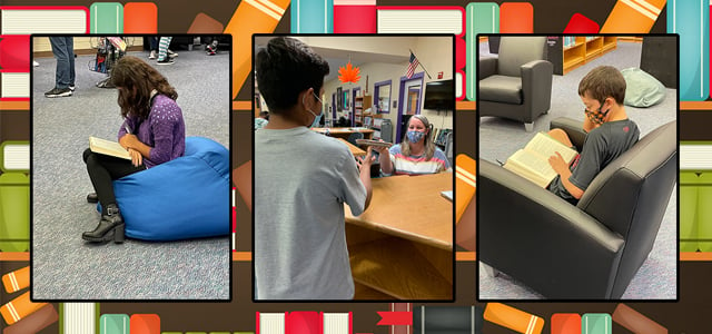 Librarian handing book to student and students reading books in library. 