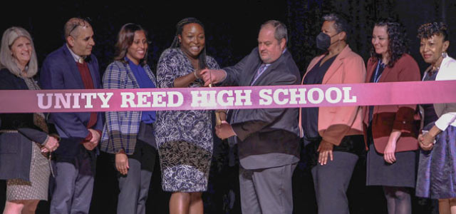 Photo of ribbon cutting at the Unity Reed High School renaming ceremony