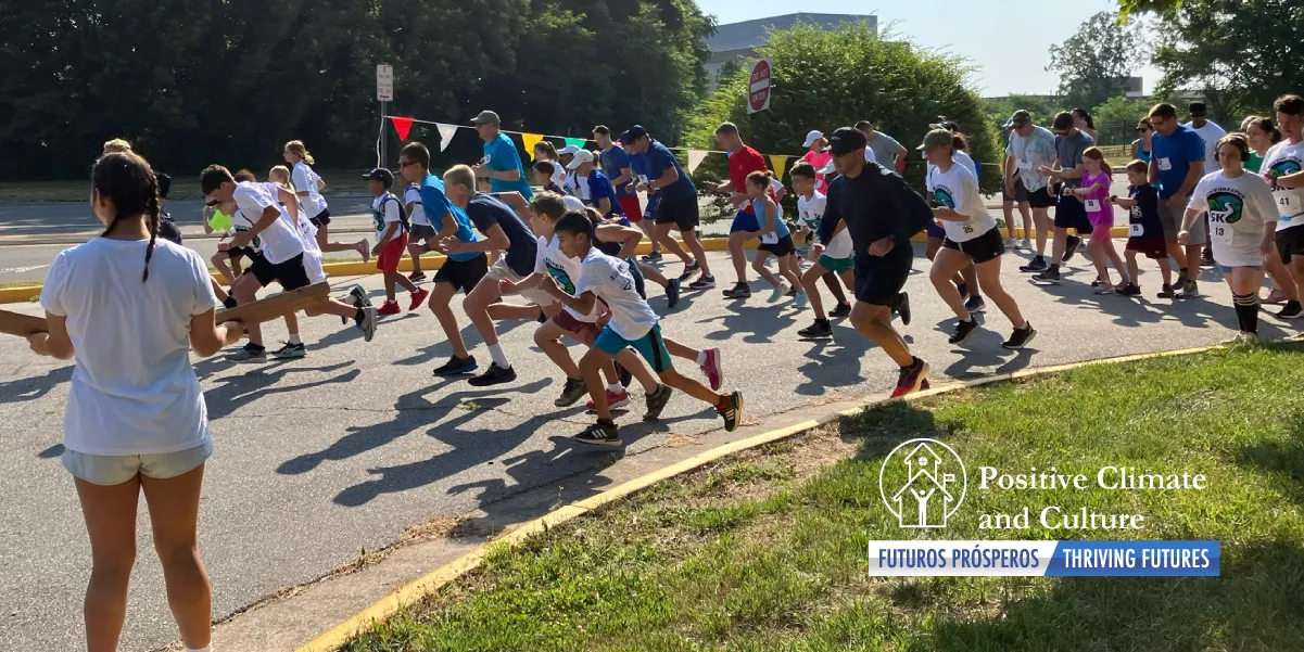 Students and adults participating in the 5k starting the race