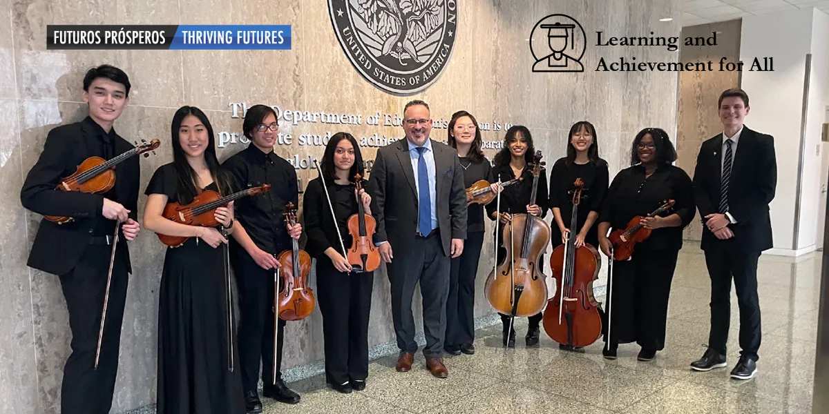 OPHS Chamber Orchestra pictured with the U.S. Secretary of Education