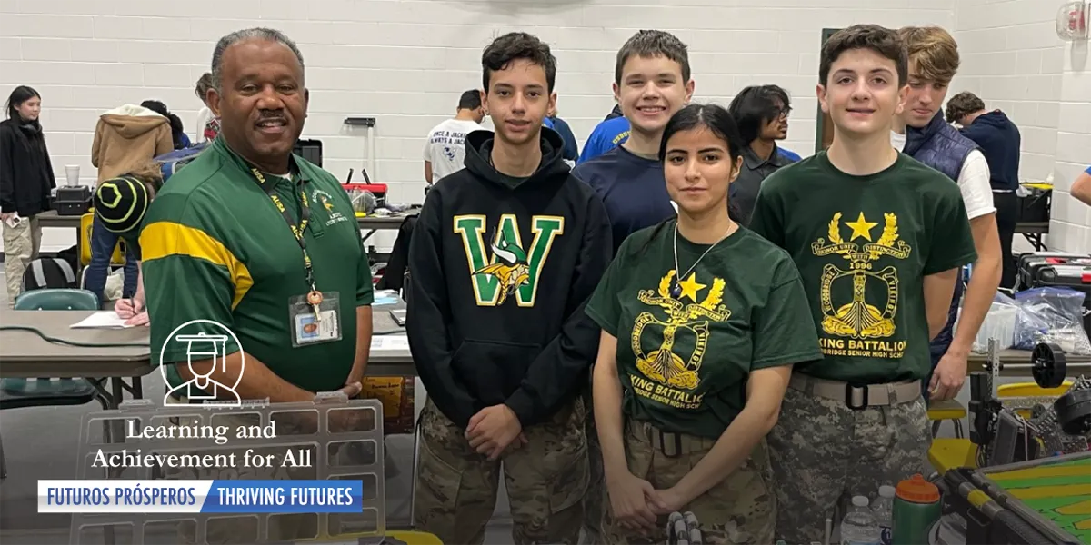 Four members of the Woodbridge HS JROTC Robotics Team and coach