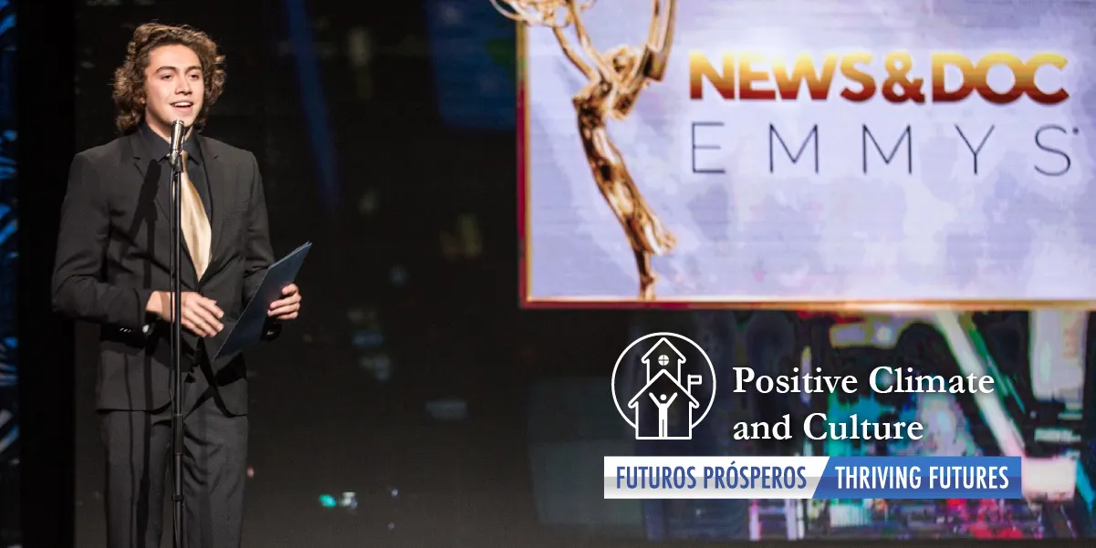 Battlefield High School student holding an Emmy award