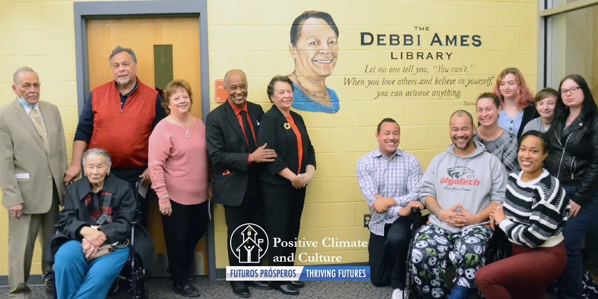 Photo of Dr. Debra M.M. Ames, family and friends at the dedication ceremony at the Nokesville School