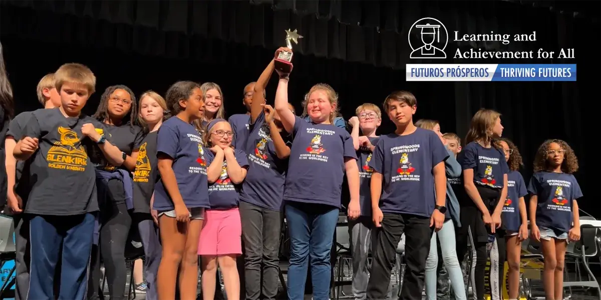 Students from Springwoods Elementary School celebrate being crowned Battle of Books champion