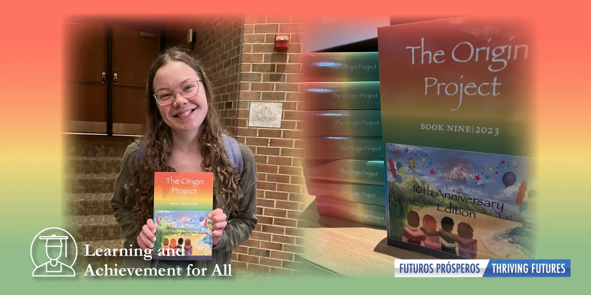 Female student smiling and holding the 10th anniversary edition of the Origin Project book