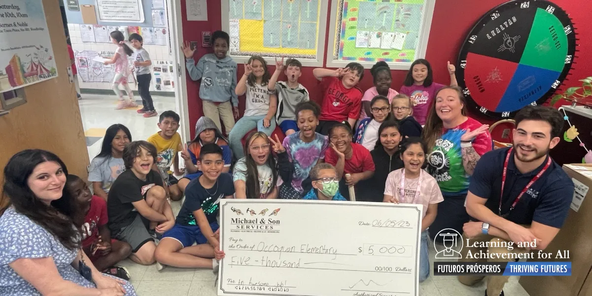 Michael and Sons presenting $5000 prize to Occoquan third graders
