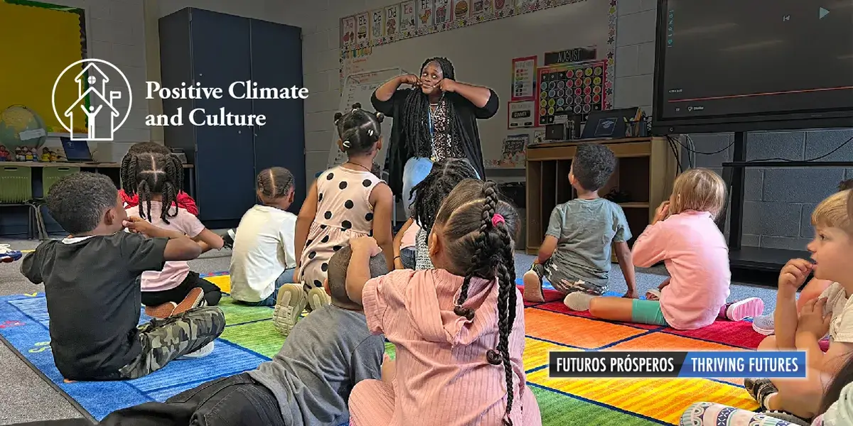 Teacher at Springwoods Elementary School being welcoming for her students